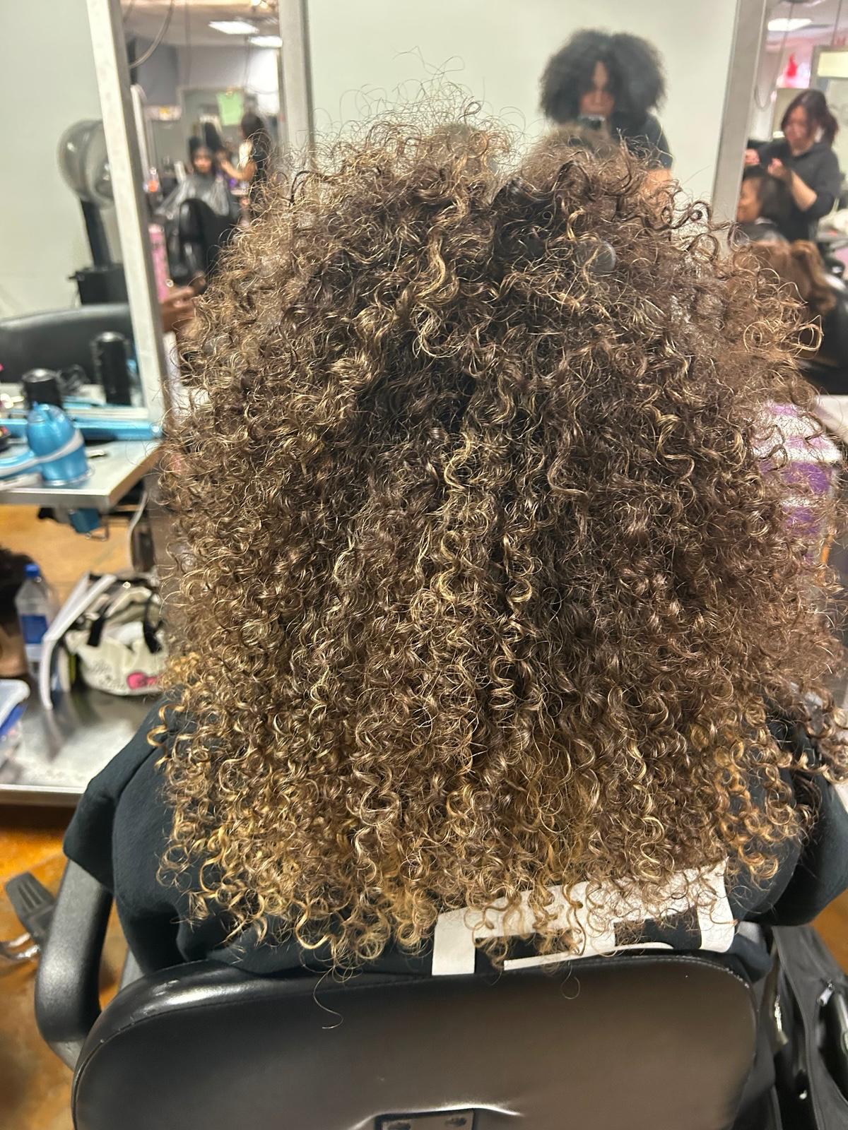 Featured curly hair work by Melanie Diaz